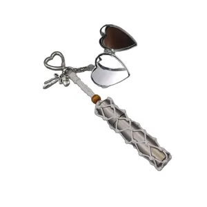 Hand-woven mesh lipstick holder with silver heart mirror and star charms keychain