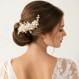 Elegant handmade pearl bridal hair comb accessory for wedding bun and updo hairstyles.