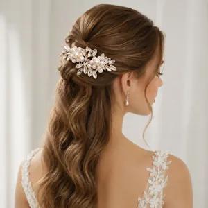 Elegant handmade bridal hair comb with pearls and rhinestones for wedding hairstyles.