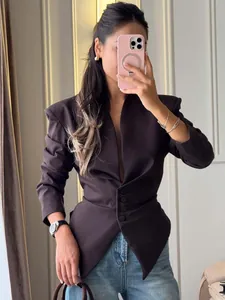 Close-up of slim fit waist-cinching chocolate brown blazer with V-neck design for women.