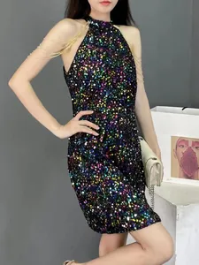 Detailed view of colorful sequin halter dress with gold chain fringe on shoulders.
