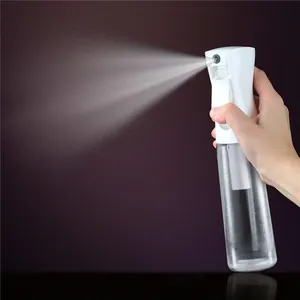 Close-up view of a fine mist continuous spray bottle showing the spraying effect