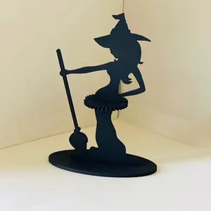 Detailed view of a black wooden witch silhouette napkin holder for Halloween decor