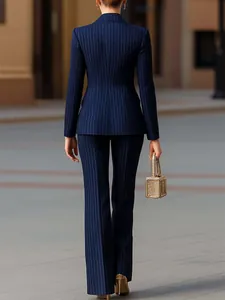 Rear view of a navy blue pinstripe slim-fit suit set for professional women's wear
