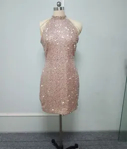 Detailed view of halter neck sequin party dress with elegant crystal tassel fringe.