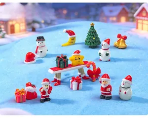 Detailed macro shot of miniature Christmas resin figurines including Santa and snowmen