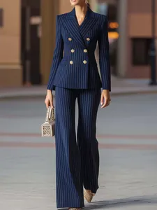 Full view of an elegant navy pinstripe double-breasted blazer and trousers suit set