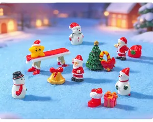 Group of miniature resin Christmas ornaments with Santa, snowmen, and tree details