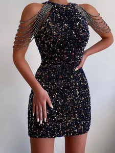 Close-up of elegant halter neck sequin mini dress with luxury crystal fringe detailing