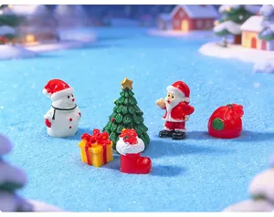 Detailed macro view of festive resin Christmas miniatures featuring Santa Claus and a snowman