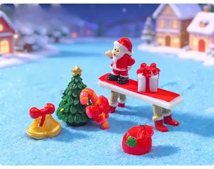 Detailed view of miniature resin Christmas ornaments including Santa and a tree