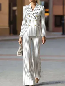 Elegant white and black striped slim-fit blazer and wide-leg trouser suit set for women.
