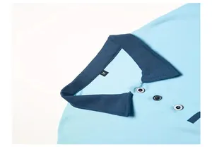 Detailed close-up view of a light blue men's polo shirt with navy blue contrast collar