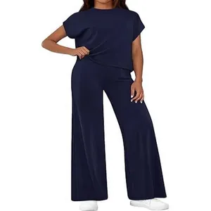 Elegant navy blue two-piece lounge set with short sleeve top and wide leg trousers