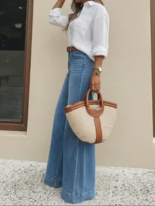 Full view of stylish retro washed wide-leg denim jeans on a model for a vintage look