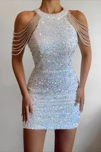 Detail view of a white sequined bodycon dress with crystal tassel shoulder details.