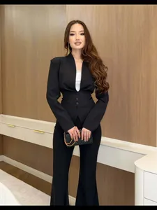 Elegant black slim fit blazer set featuring a waist-cinching design and deep V-neckline