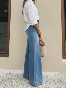 Professional side view shot of high-waisted vintage washed wide-leg blue denim jeans for women