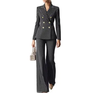 Elegant black and white vertical striped blazer and flare pants suit set for women.