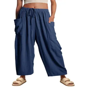 Full view of blue loose cotton linen wide leg cropped pants with elastic waist and pockets
