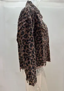 Side view of a cropped leopard print denim jacket with raw hem detail.