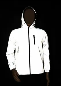 Detail view showing the high-visibility reflective effect of the outdoor jacket in the dark