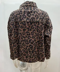 Detail view of the back of a cropped leopard print denim jacket with visible stitching.