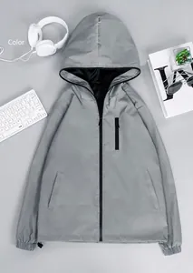 Close-up of grey reflective hooded windbreaker jacket with black zippers