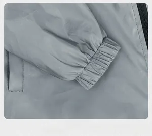 Detailed macro shot of elastic cuff on a silver gray reflective outdoor windbreaker jacket