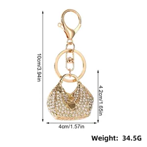 Detailed view of rhinestone heart handbag keychain with dimensions and weight info