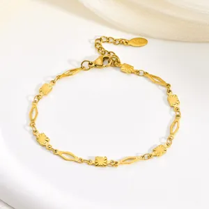 Detailed close-up of a gold stainless steel bracelet with geometric diamond links