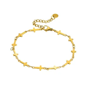 Elegant gold stainless steel bracelet featuring multiple small cross charms linked on a chain