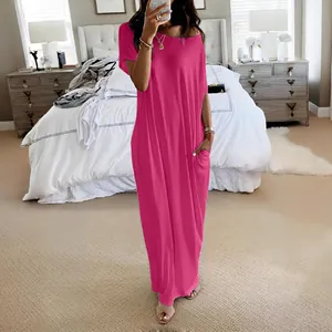 Full-length view of a fuchsia short-sleeved casual maxi dress with side pockets.