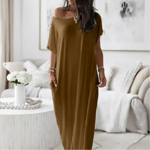Full view of casual solid brown short-sleeved maxi dress with functional side pocket