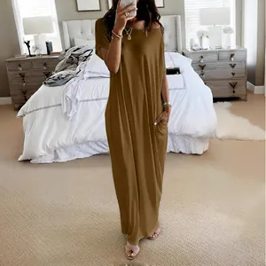 Casual solid brown short sleeve maxi dress with pockets shown in bedroom mirror selfie
