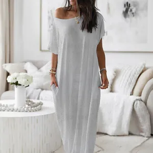 Comfortable grey short-sleeve maxi dress with pockets shown in a cozy home environment