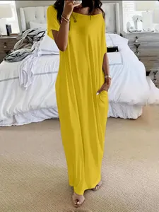 Loose bright yellow short-sleeve maxi dress with functional pockets for summer casual style