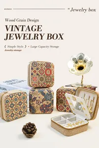 Detail view of bohemian print jewelry box with organized slots for rings and necklaces