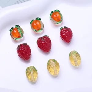 Detailed macro view of assorted mini fruit glass beads for DIY jewelry crafts