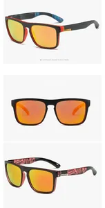 Close-up of polarized sports sunglasses with orange mirrored lenses and black-red frame.