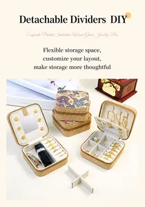 Detailed view of portable jewelry box with floral patterns and adjustable dividers