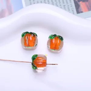 Close-up of mini fruit-shaped glass beads with hole for DIY jewelry making