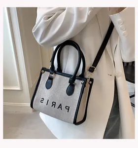 Fashionable canvas tote bag with PARIS print and black leather trim for women