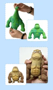 Close-up of green and brown gorilla stress toys being stretched and held