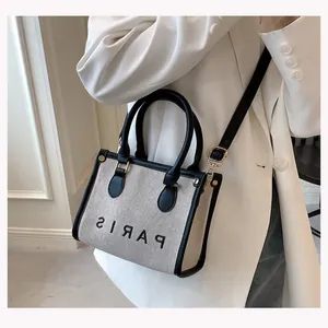 Stylish canvas tote bag with PARIS print and black leather trim for modern women