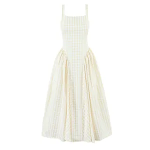 Detail view of French style gingham dress with square neck and elegant pleated skirt