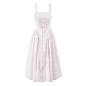 Elegant back view of a pink gingham dress featuring a delicate lace-up bodice detail