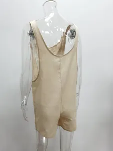 Detailed back view of a casual beige cotton linen romper overalls on a clear mannequin