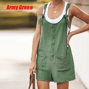 Close-up detail of army green cotton linen overalls with patch pockets and tie straps
