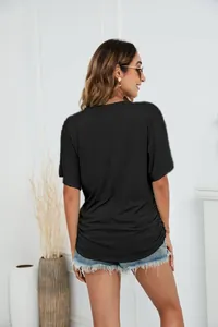 Back view of a women's casual loose black short-sleeved cotton T-shirt top